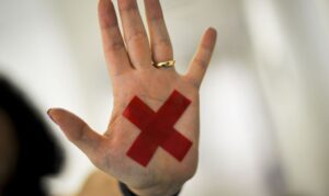 女性に対する暴力に反対する事を示すマーク（Marcello Casal Jr./Agencia Brasil）