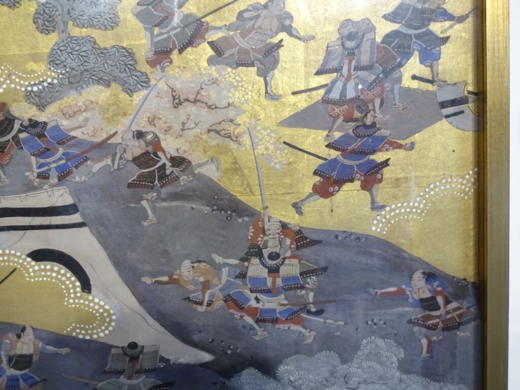 頭のない武士の伝説が描かれた屏風絵の一部