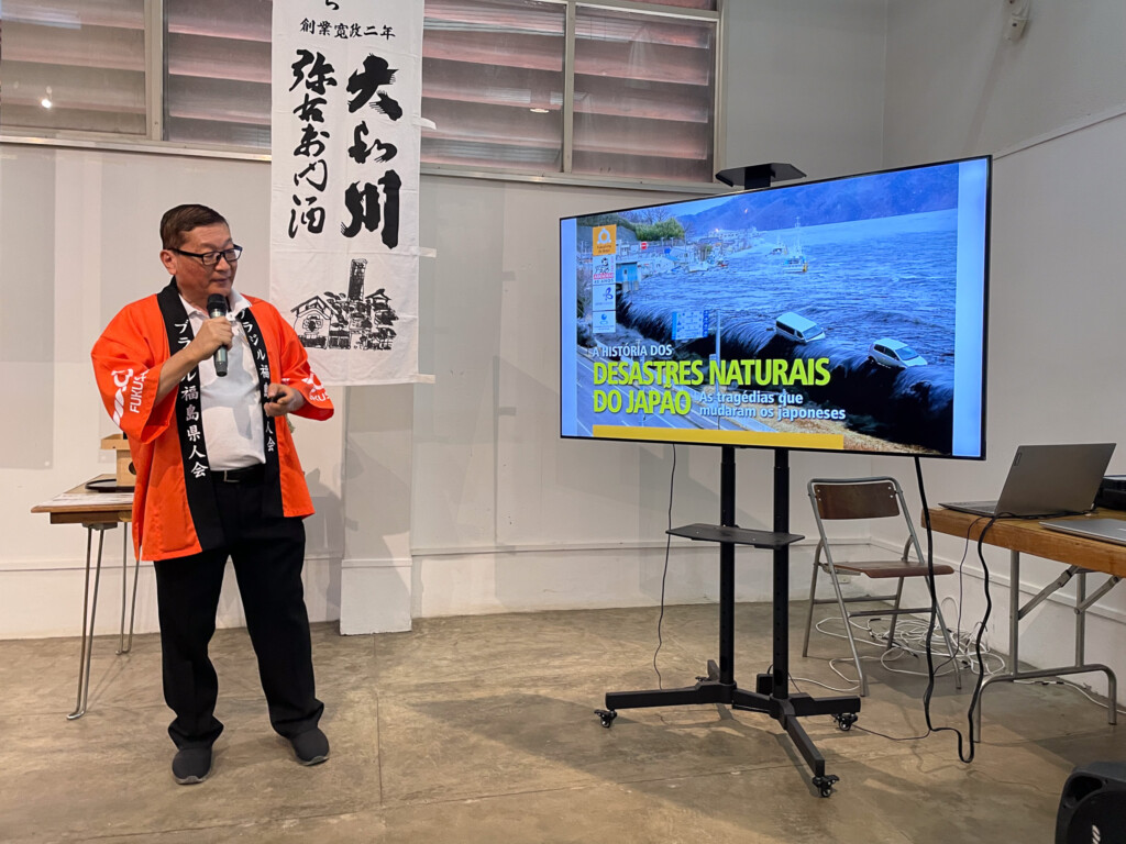 講演を行う佐藤会長