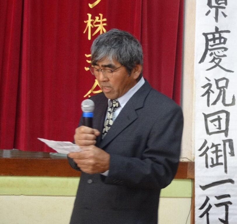 歓迎あいさつする徳久会長